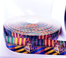 Load image into Gallery viewer, Magic Crest Grosgrain Ribbon. Magic Party Ribbon. Pictures don't give this ribbon justice comes in 5/8" 7/8" and 1.5"