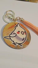 Load and play video in Gallery viewer, Handmade Cockatiel Hand-Sculpted Polymer Clay Keychain with Resin Overlay — Bird Keychain
