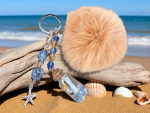 Load image into Gallery viewer, Beach Keychain. Ocean Starfish Keychain. Keyfob. Purse Accessories. Purse Charms. Purse Jewelry. Car Ornament. Lost Bottle. Pom Pom Ball.
