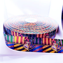 Load image into Gallery viewer, Magic Crest Grosgrain Ribbon. Magic Party Ribbon. Pictures don&#39;t give this ribbon justice comes in 5/8&quot; 7/8&quot; and 1.5&quot;
