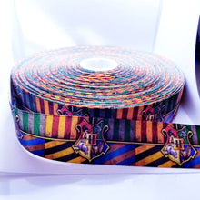 Load image into Gallery viewer, Magic Crest Grosgrain Ribbon. Magic Party Ribbon. Pictures don&#39;t give this ribbon justice comes in 5/8&quot; 7/8&quot; and 1.5&quot;
